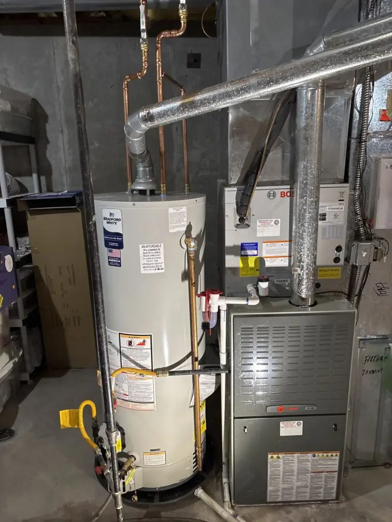 Recent Projects 23 Water heater installation next to a furnace in a finished basement
